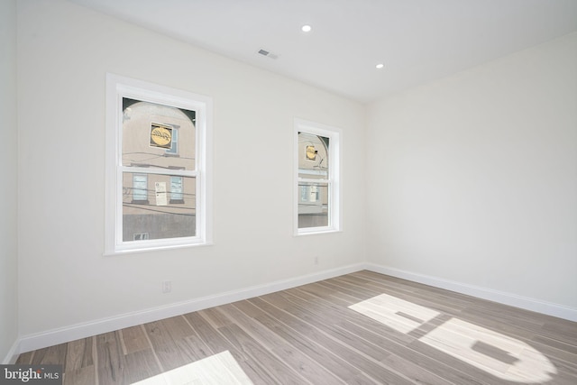 empty room featuring hardwood / wood-style floors