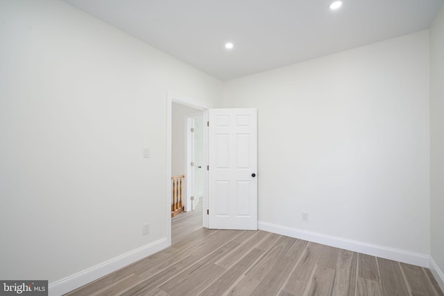 spare room with light hardwood / wood-style flooring