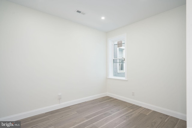 empty room with light wood-type flooring