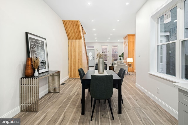 dining space with light wood-type flooring