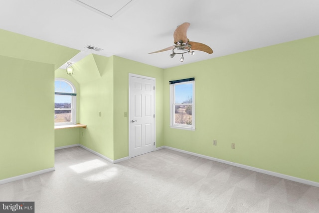 unfurnished bedroom featuring ceiling fan and light carpet