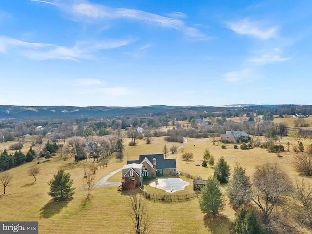 birds eye view of property with a rural view and a mountain view