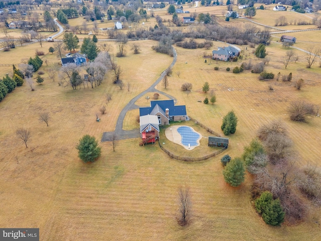 birds eye view of property with a rural view