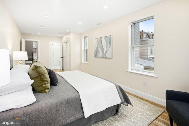 bedroom with hardwood / wood-style flooring