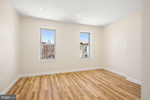 spare room with light wood-type flooring