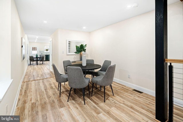 dining room featuring light hardwood / wood-style floors