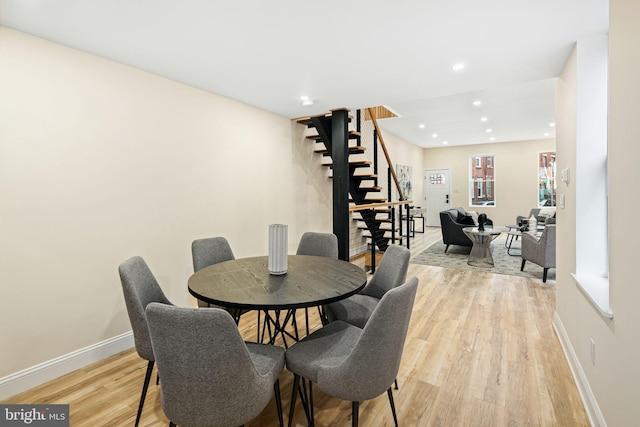 dining space with light hardwood / wood-style flooring