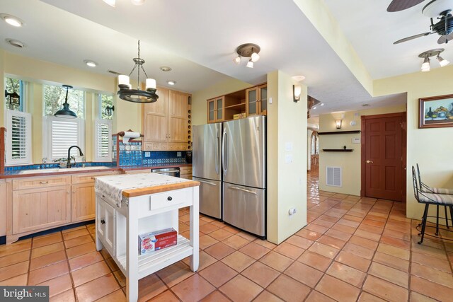 12330 Potomac View Rd, Newburg, MD 20664 - kitchen featuring open shelves, stainless steel appliances, light brown cabinets, tasteful backsplash, and ceiling fan