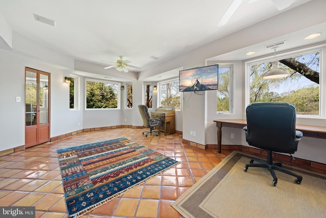 tiled office featuring ceiling fan