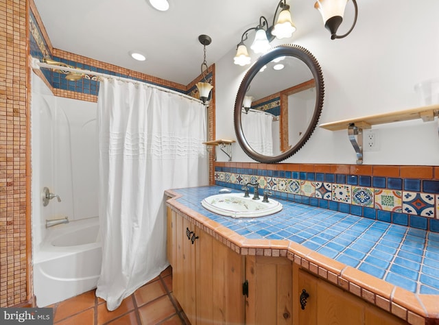 bathroom featuring tile patterned flooring, shower / bath combo, vanity, and tasteful backsplash