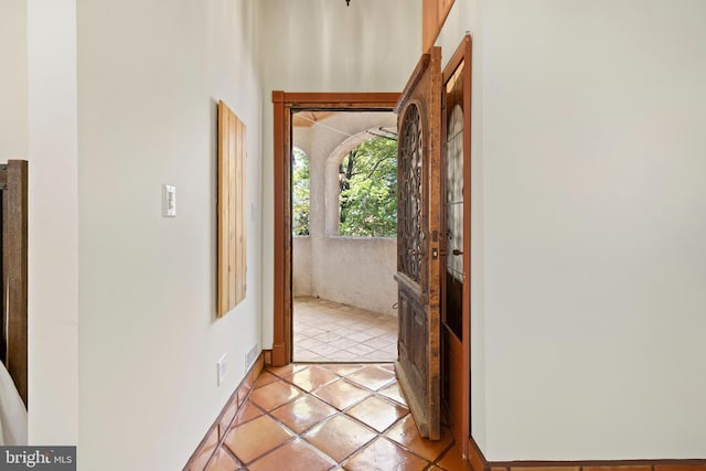 doorway to outside featuring light tile patterned floors