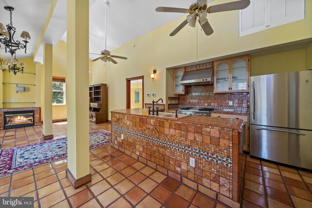 12330 Potomac View Rd, Newburg, MD 20664 - kitchen featuring freestanding refrigerator, a ceiling fan, backsplash, high vaulted ceiling, and a sink
