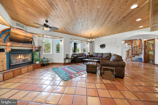 12330 Potomac View Rd, Newburg, MD 20664 - living area with tile patterned floors, a fireplace, wood ceiling, recessed lighting, and stairs