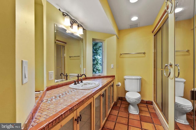 12330 Potomac View Rd, Newburg, MD 20664 - bathroom featuring toilet, a stall shower, vanity, and tile patterned floors