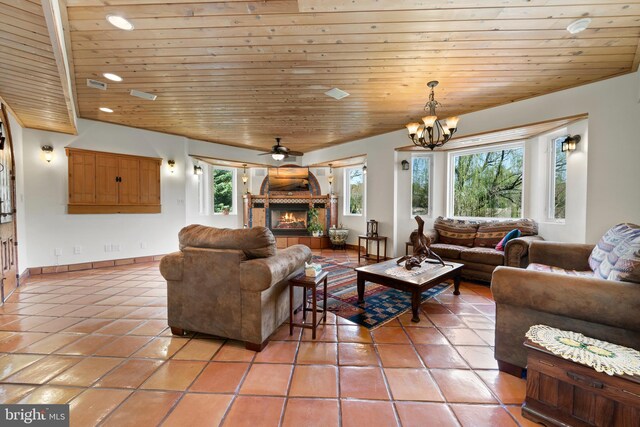 12330 Potomac View Rd, Newburg, MD 20664 - living room with light tile patterned flooring, a warm lit fireplace, wooden ceiling, a chandelier, and recessed lighting