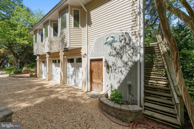 12330 Potomac View Rd, Newburg, MD 20664 - back of house featuring a garage and driveway