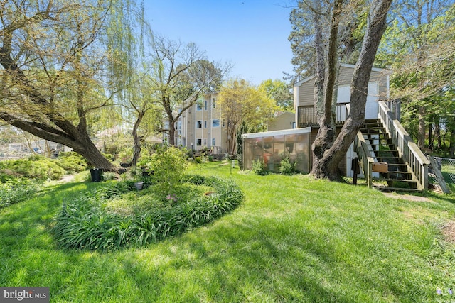 view of yard with a sunroom