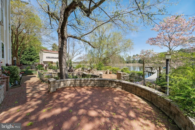 view of patio featuring a water view