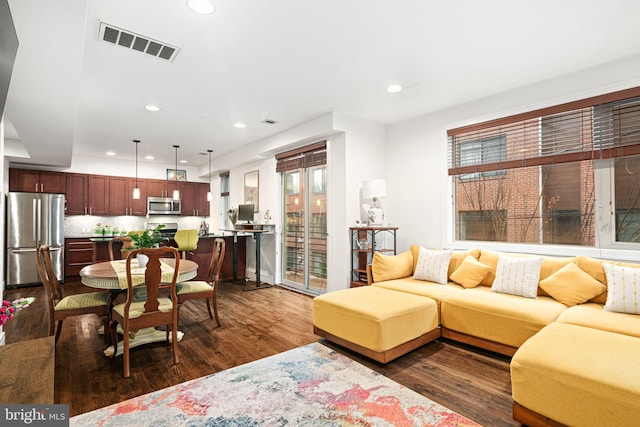 living room featuring dark hardwood / wood-style flooring