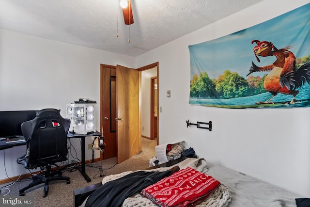 bedroom featuring carpet, a textured ceiling, and ceiling fan