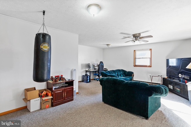 carpeted living room featuring a textured ceiling and ceiling fan