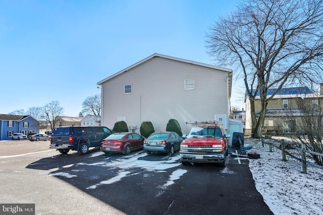 view of snow covered parking area