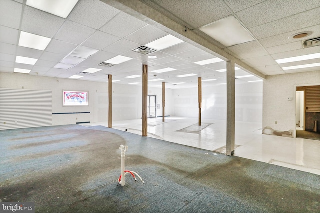 interior space featuring a drop ceiling