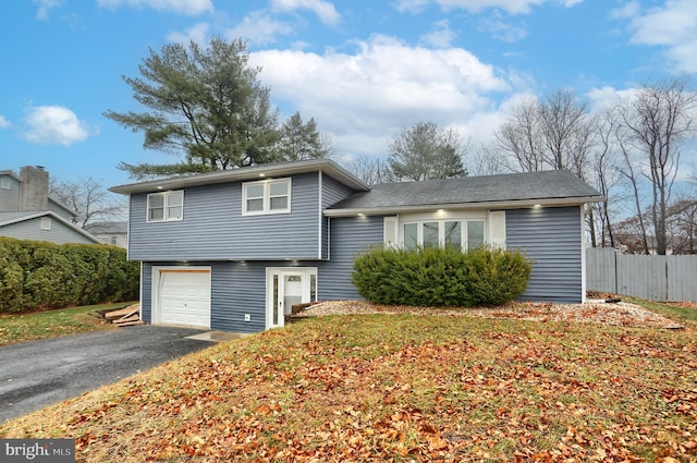 split level home with a garage