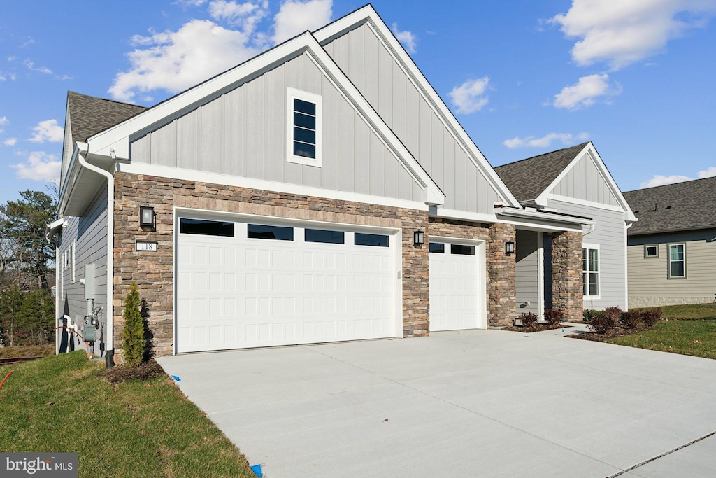 118 Nandina Pl, Lake Frederick, VA 22630 - craftsman house with board and batten siding, stone siding, concrete driveway, and roof with shingles