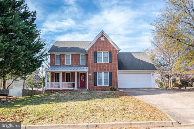 view of front facade featuring a porch, a garage, and a front lawn