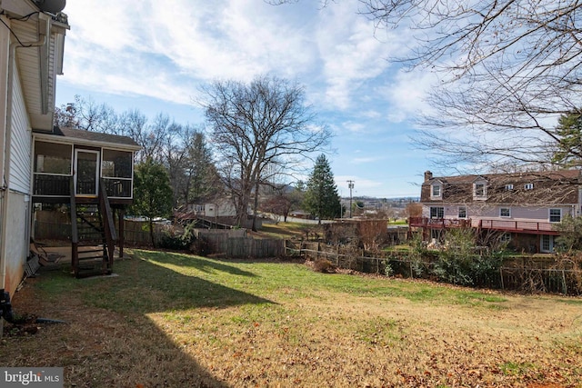 view of yard featuring a sunroom