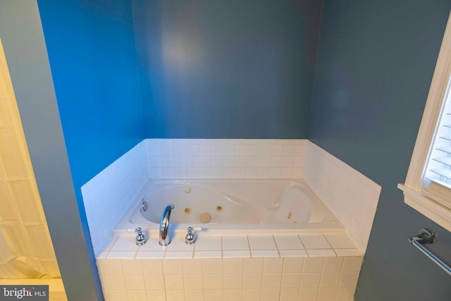 bathroom featuring tiled bath