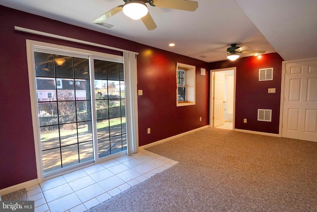 empty room featuring light carpet and ceiling fan