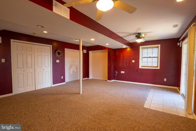 interior space featuring carpet and ceiling fan