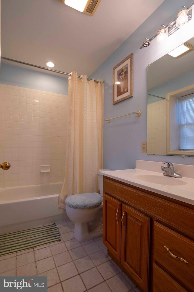 full bathroom with tile patterned floors, shower / bath combination with curtain, toilet, and vanity