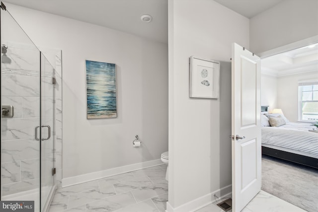 bathroom with an enclosed shower and toilet