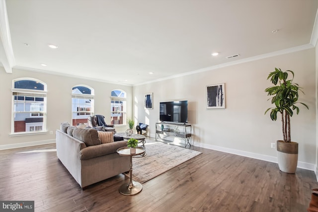 living room with dark hardwood / wood-style floors and ornamental molding