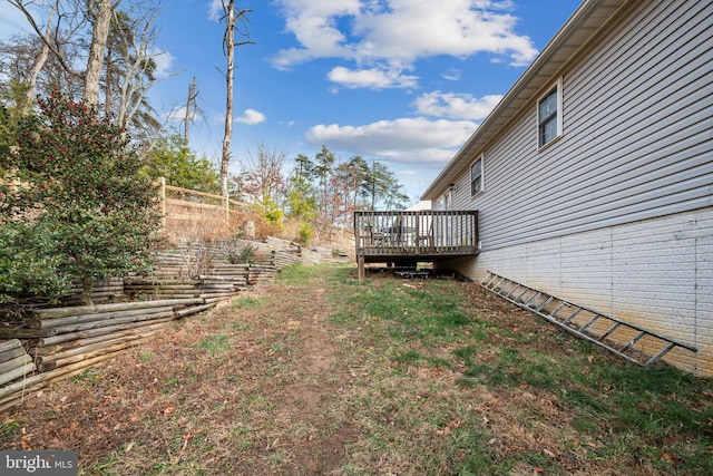 view of yard with a wooden deck