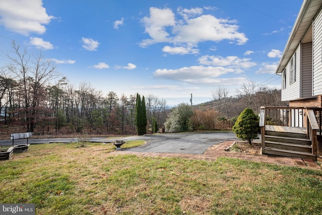 view of yard with a deck