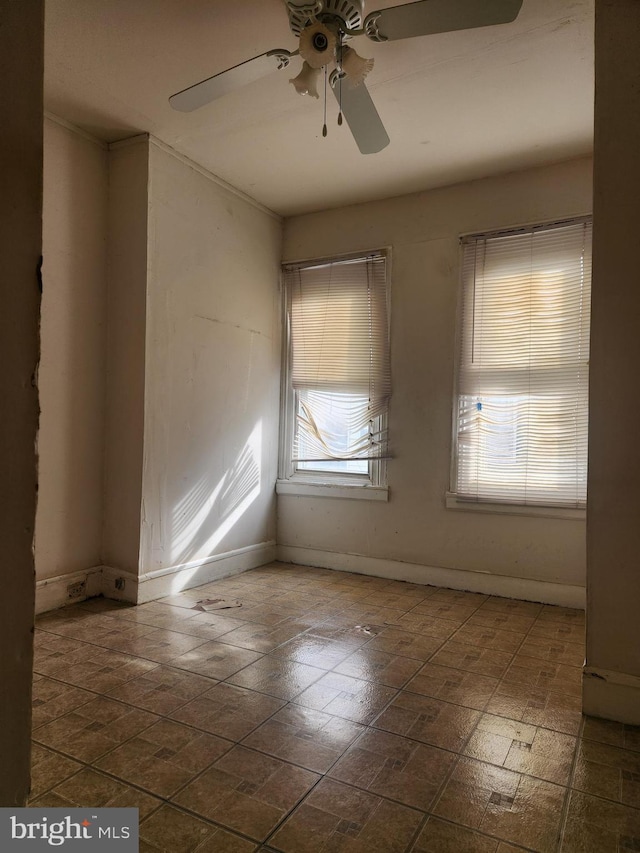 spare room with ceiling fan