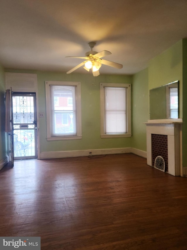 unfurnished living room with hardwood / wood-style floors and ceiling fan