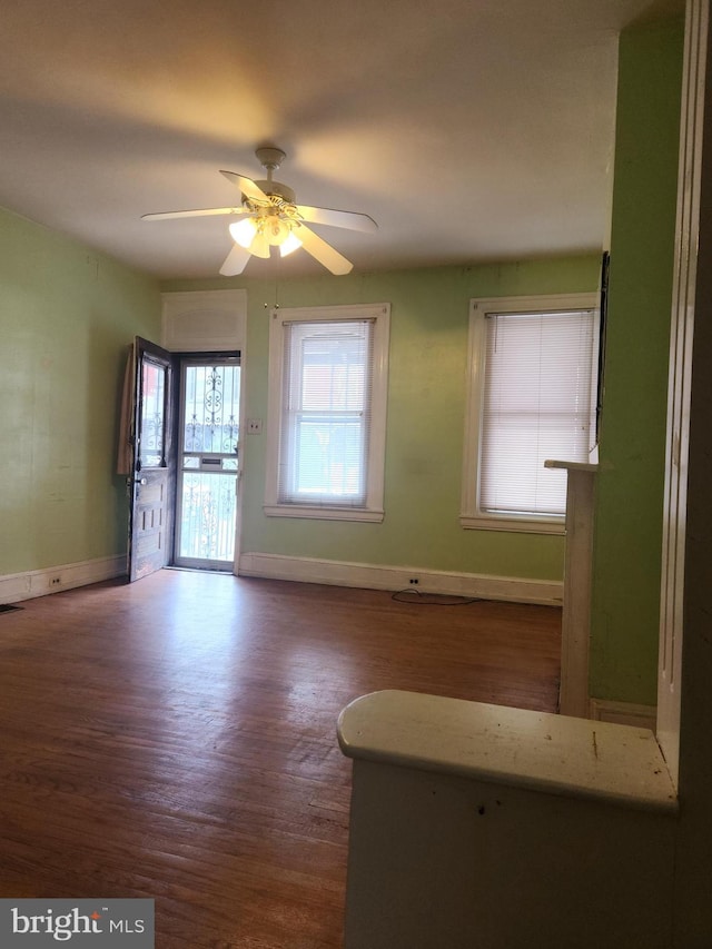 empty room featuring ceiling fan and hardwood / wood-style floors