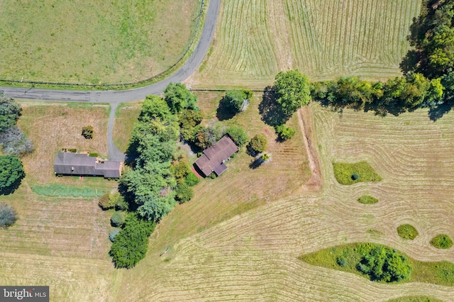 birds eye view of property featuring a rural view