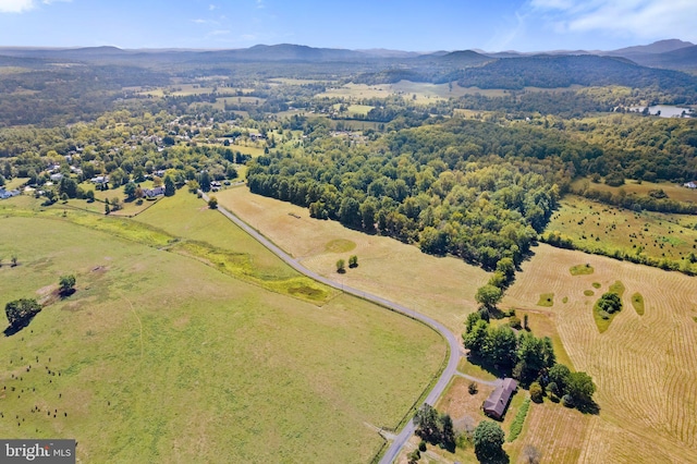 drone / aerial view with a mountain view and a rural view