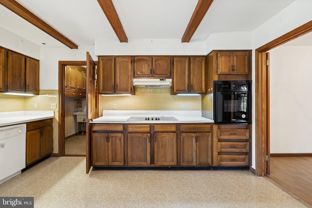 kitchen with black appliances, beam ceiling, light hardwood / wood-style floors, and tasteful backsplash