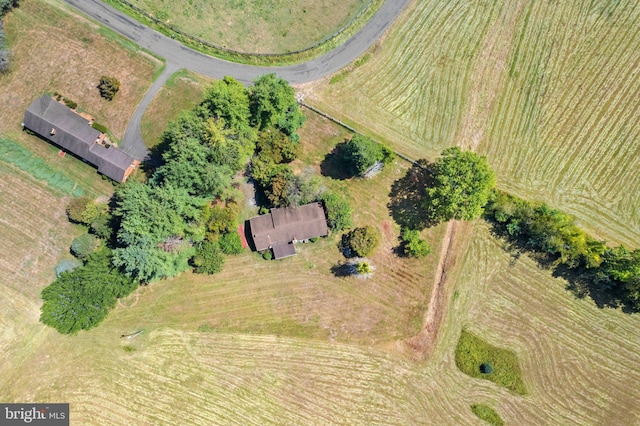 birds eye view of property with a rural view