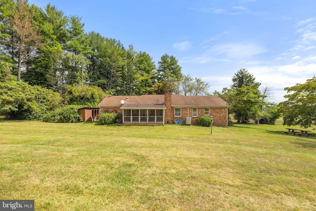 view of yard featuring a sunroom