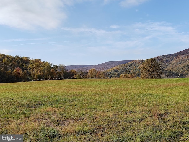 property view of mountains featuring a rural view