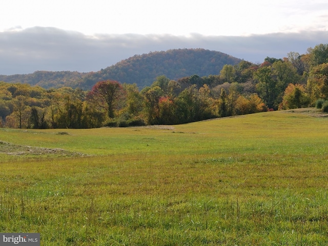 mountain view featuring a rural view