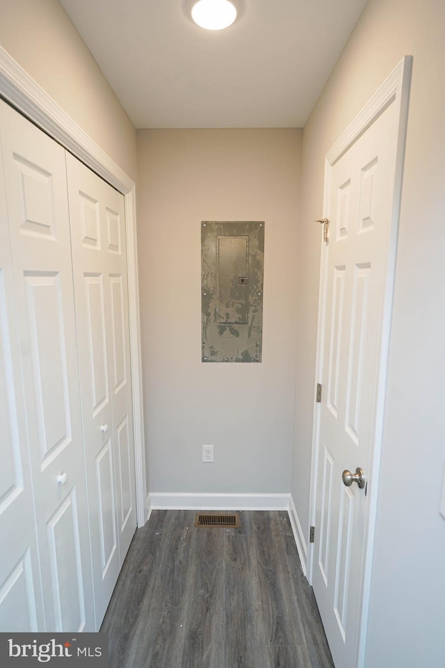 hallway featuring dark hardwood / wood-style floors